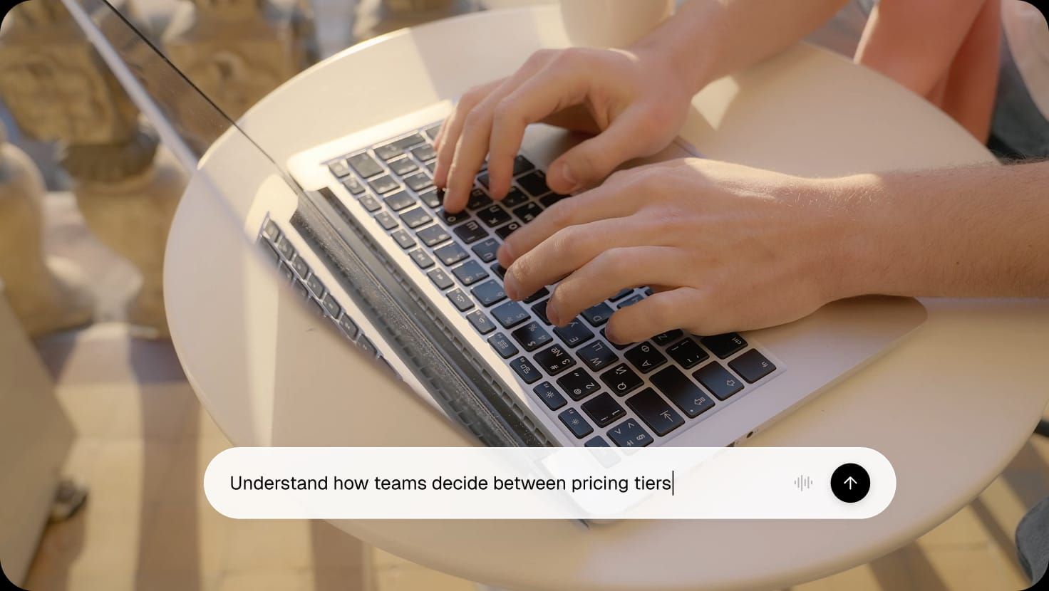 Researcher typing a research goal on a laptop, with Cookiy AI discussion guide generator